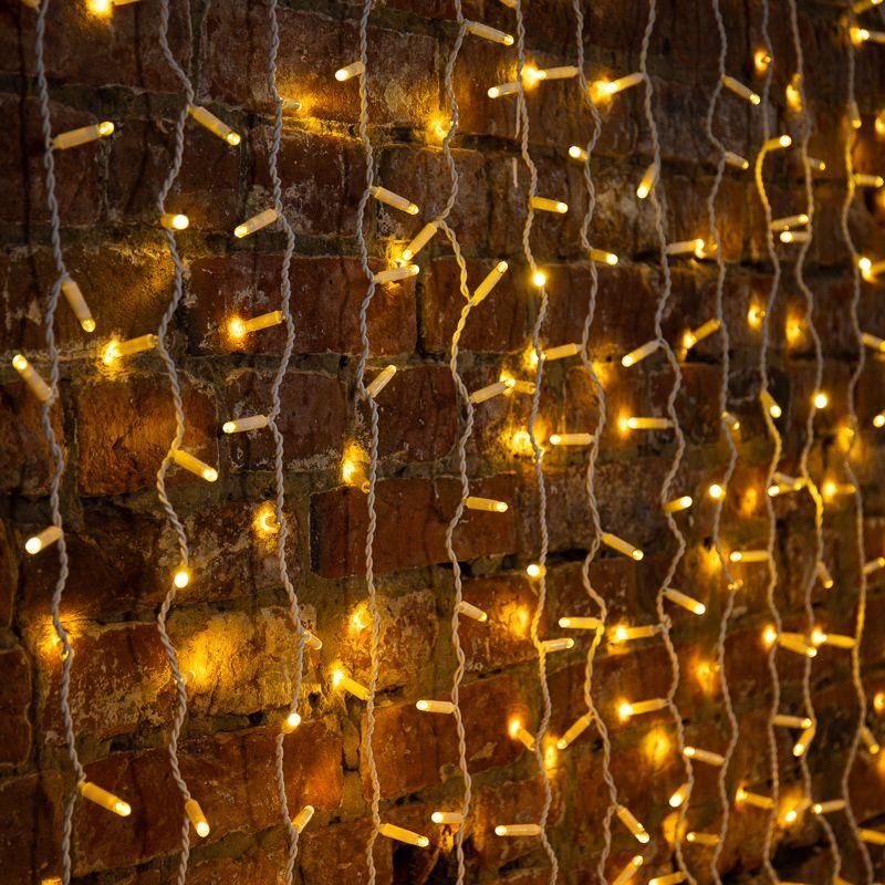 Гирлянда светодиодная "Дождь" 2х6м 768LED тепл. бел. 70Вт 230В IP65 эффект мерцания провод бел. (партия 2020 - 768LED) Neon-Night 235-396